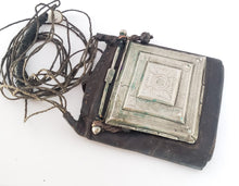 Load image into Gallery viewer, Tuareg Silver on Leather Gris Gris hand engraved amulet pendant leather cord necklace,Tuareg jewelry ,Sahara jewelry ,moroccan jewelry
